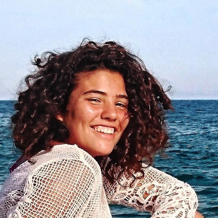 Alex Rivera, Lead Design Curator at Clarivex Signal Node, reviewing corporate floral arrangements